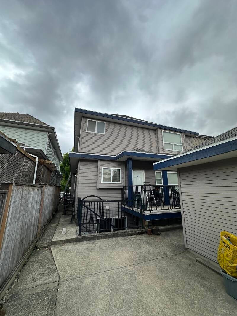 Professional exterior house painting process in Langley, BC by Tidy Brush Painting.