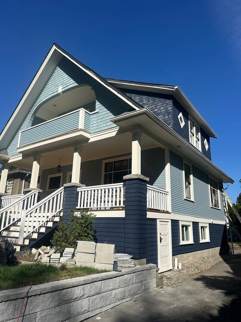 Professional exterior painter near me painting a residential home in Vancouver