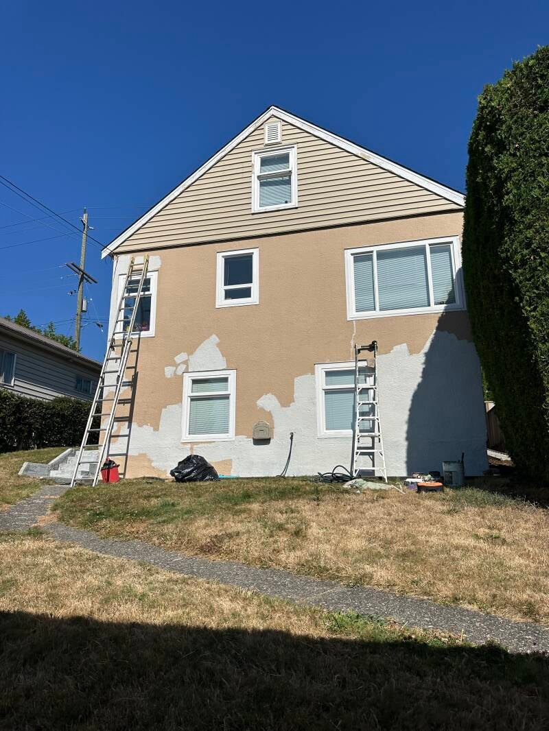 Before exterior house painting in New Westminster, BC showing the home's original exterior before professional painting by Tidy Brush Painting.