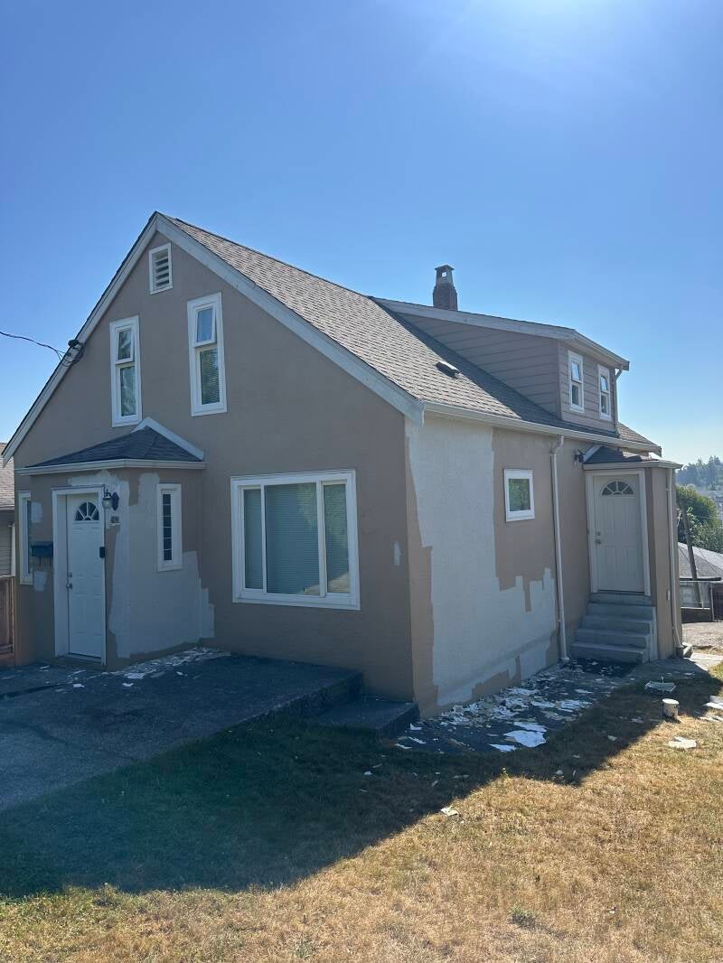 Residential home exterior in New Westminster before painting, showing the existing siding, trim and exterior surfaces.