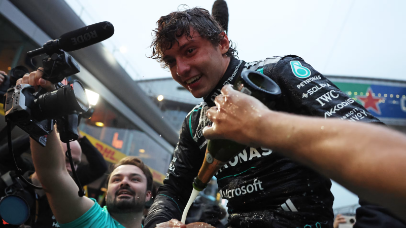 Kimi Antonelli being showered in champagne following his maiden win in China