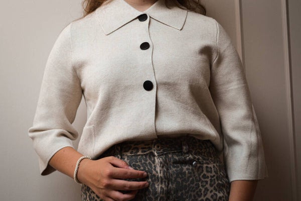 Truitje zwarte knopen zand