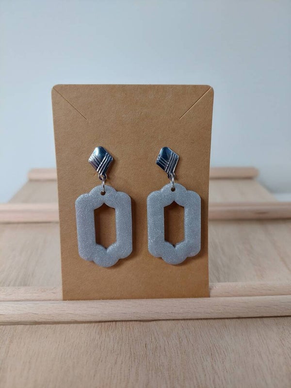 Oorringen rvs zilverkleurig met zilvere klei hanger