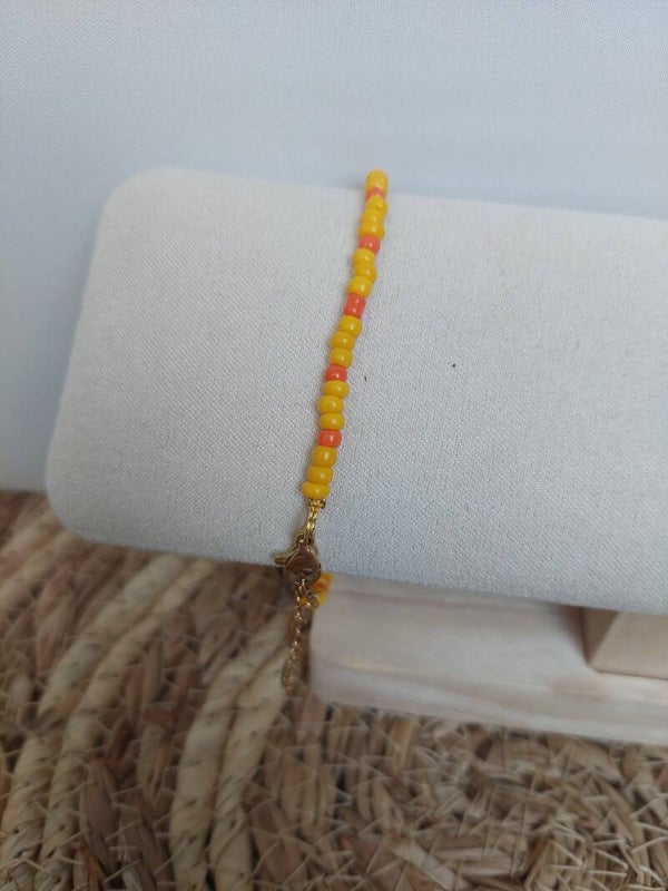 Armbandje geel oranje goud