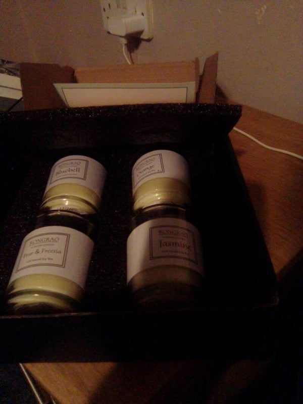 Four new small candles in a box