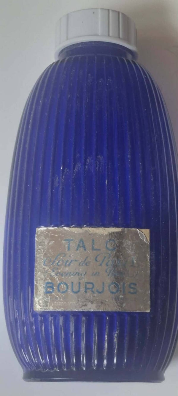 Poederflacon – geribbeld blauw glas – Soir de Paris label – 13 cm – met restje poeder.