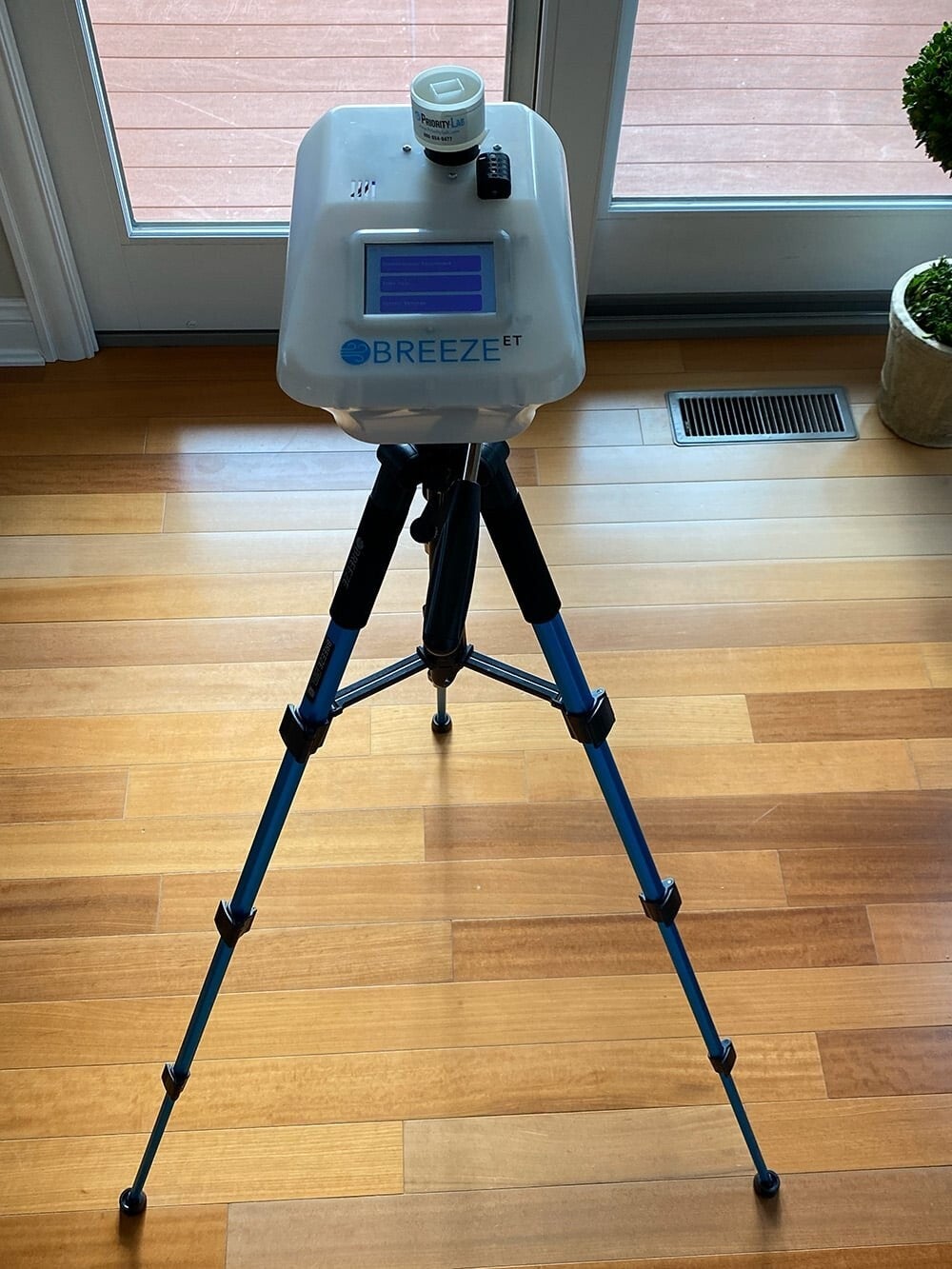 Breeze air sampling pump set up for an indoor mold air test in a Colorado home