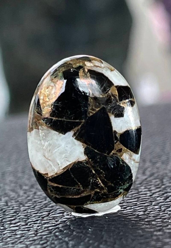 Calciet edelsteen met Koper cabochon ovaal, medium