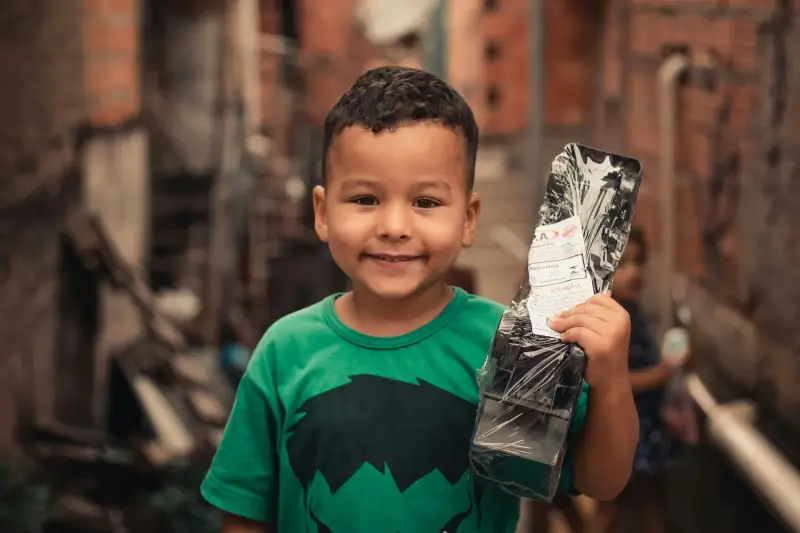 supported child holding toy