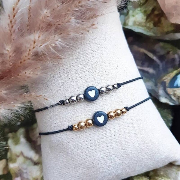 Elastiek armbandje met hartje en rvs kraaltjes