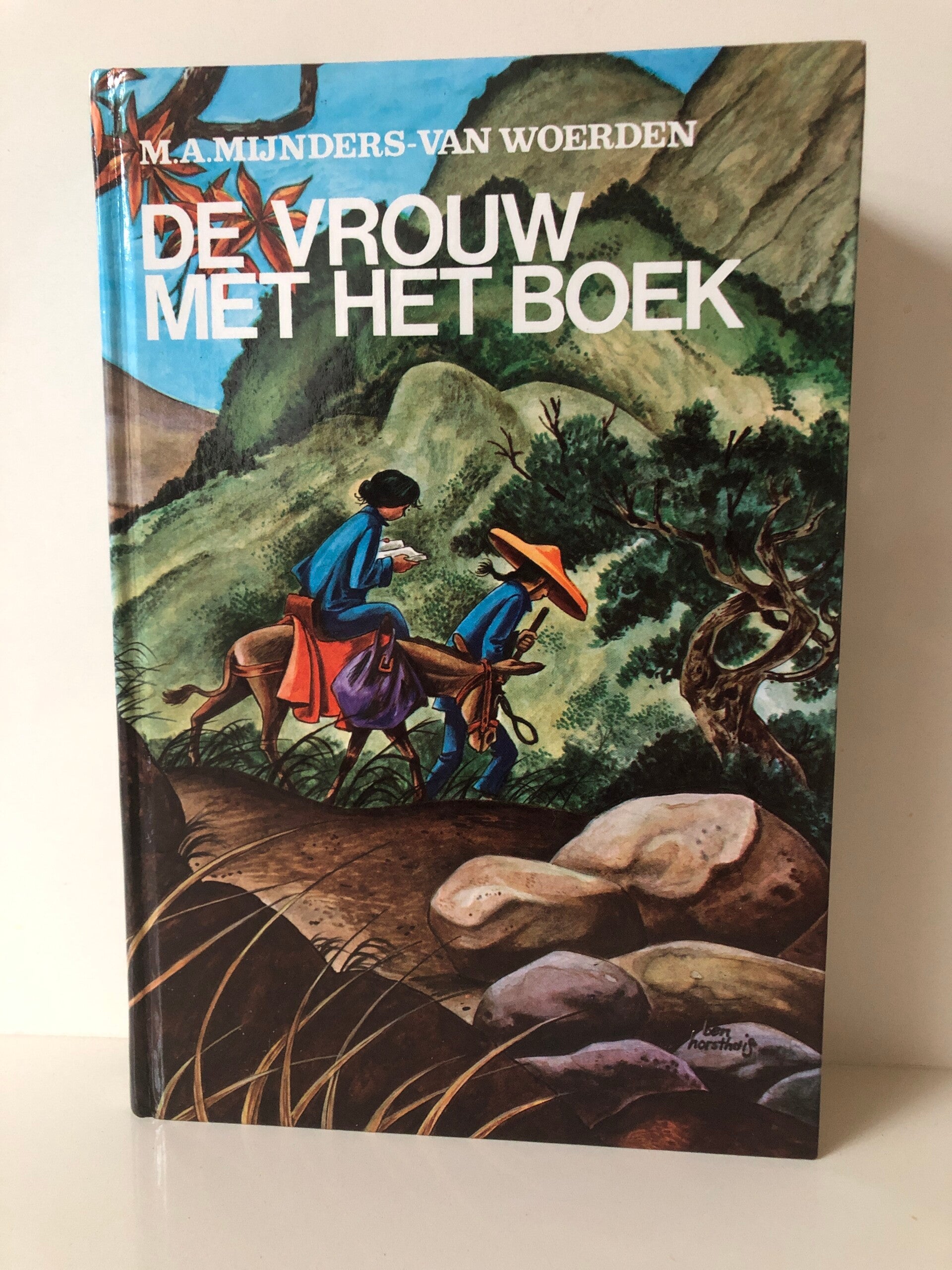 De vrouw met het boek. Schrrijver: M.A.Mijnders- van Woerden
