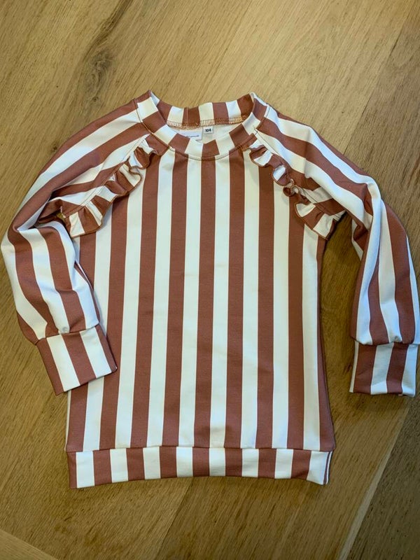 Lange sweater met ruffel