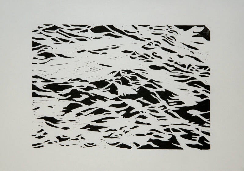 black and white linocut of waves