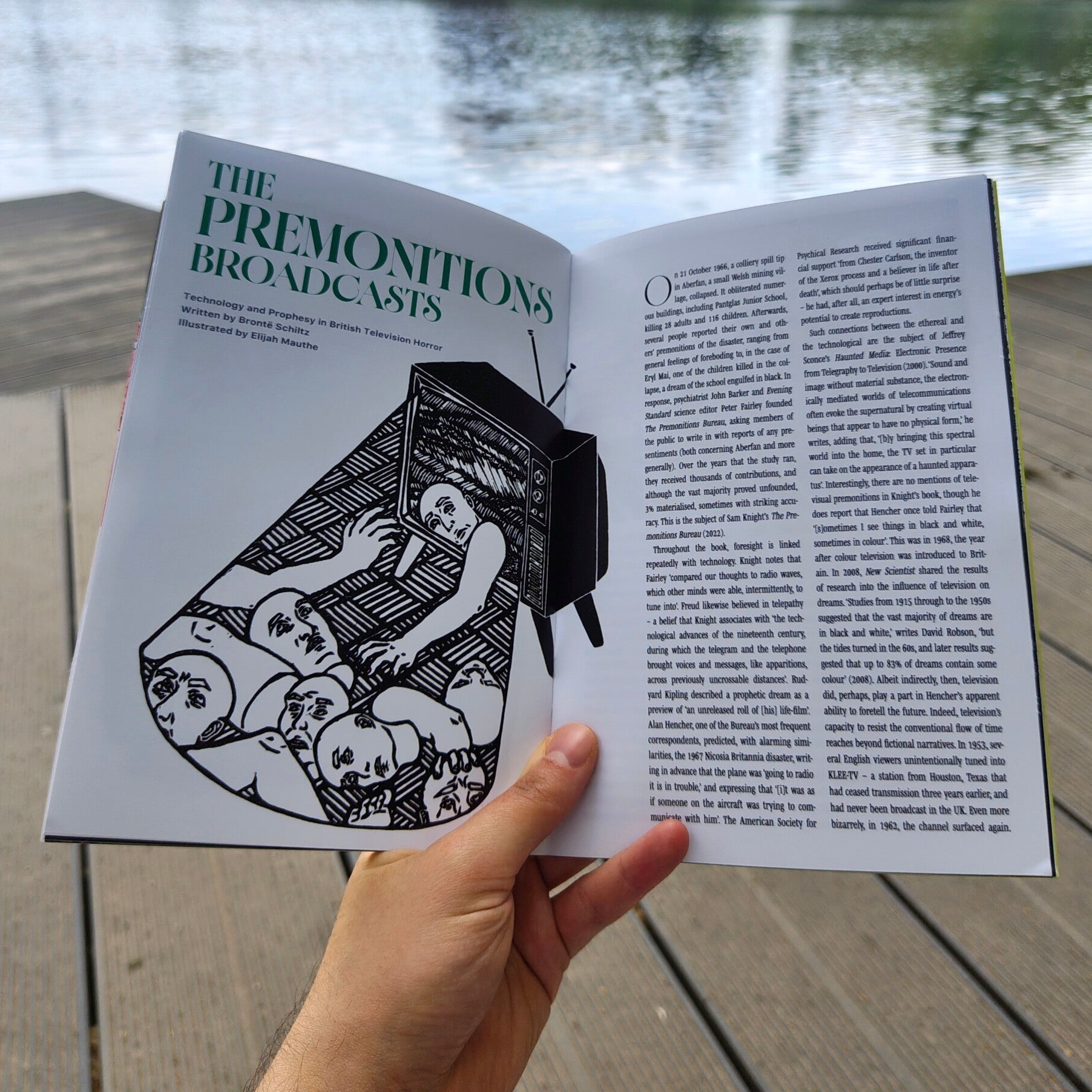 Illustration in the General Witchfinders Zine. The illustrations is a black and white linocut showing a 70s TV showing static. A figure is crawling out of the TV. The glow is shining on a pile of limbs and heads on the floor.