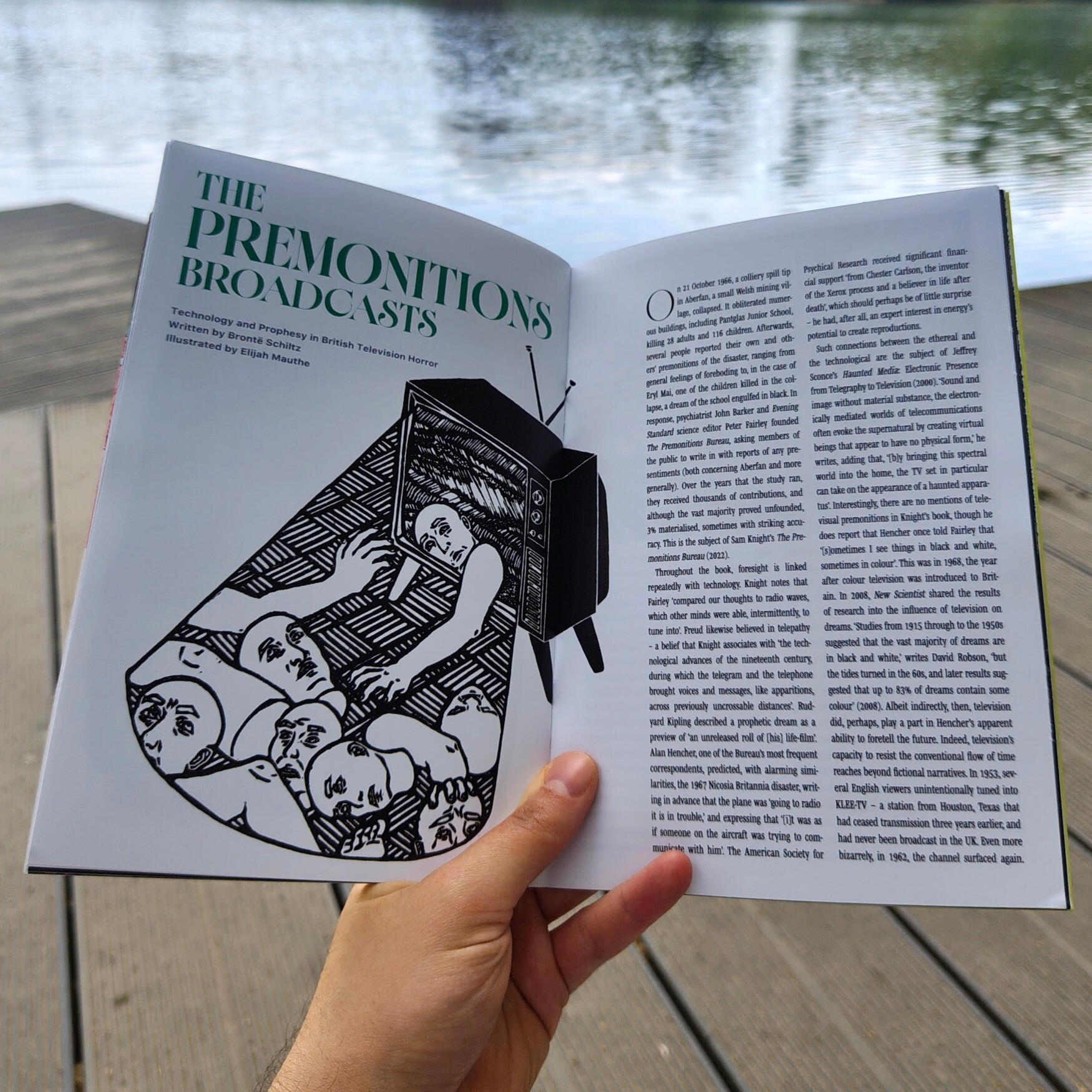 Illustration in the General Witchfinders Zine. The illustrations is a black and white linocut showing a 70s TV showing static. A figure is crawling out of the TV. The glow is shining on a pile of limbs and heads on the floor.