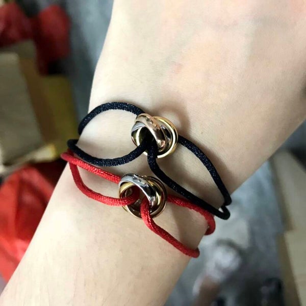 CARTIER brazaletes (Cordón con dije en plata)