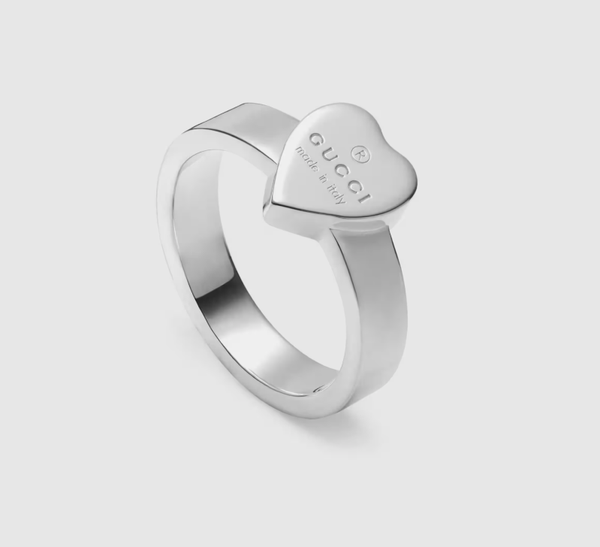 Trademark ring with heart pendant