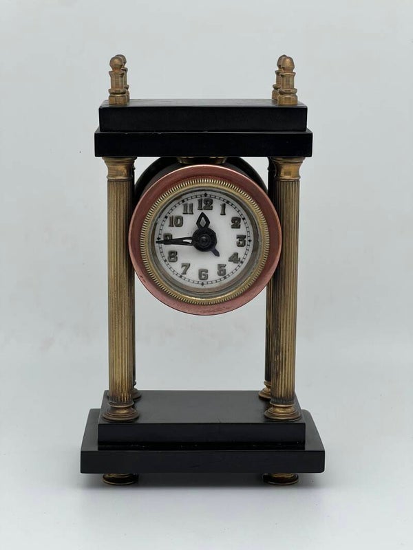 M2: Miniatuur kolompendule