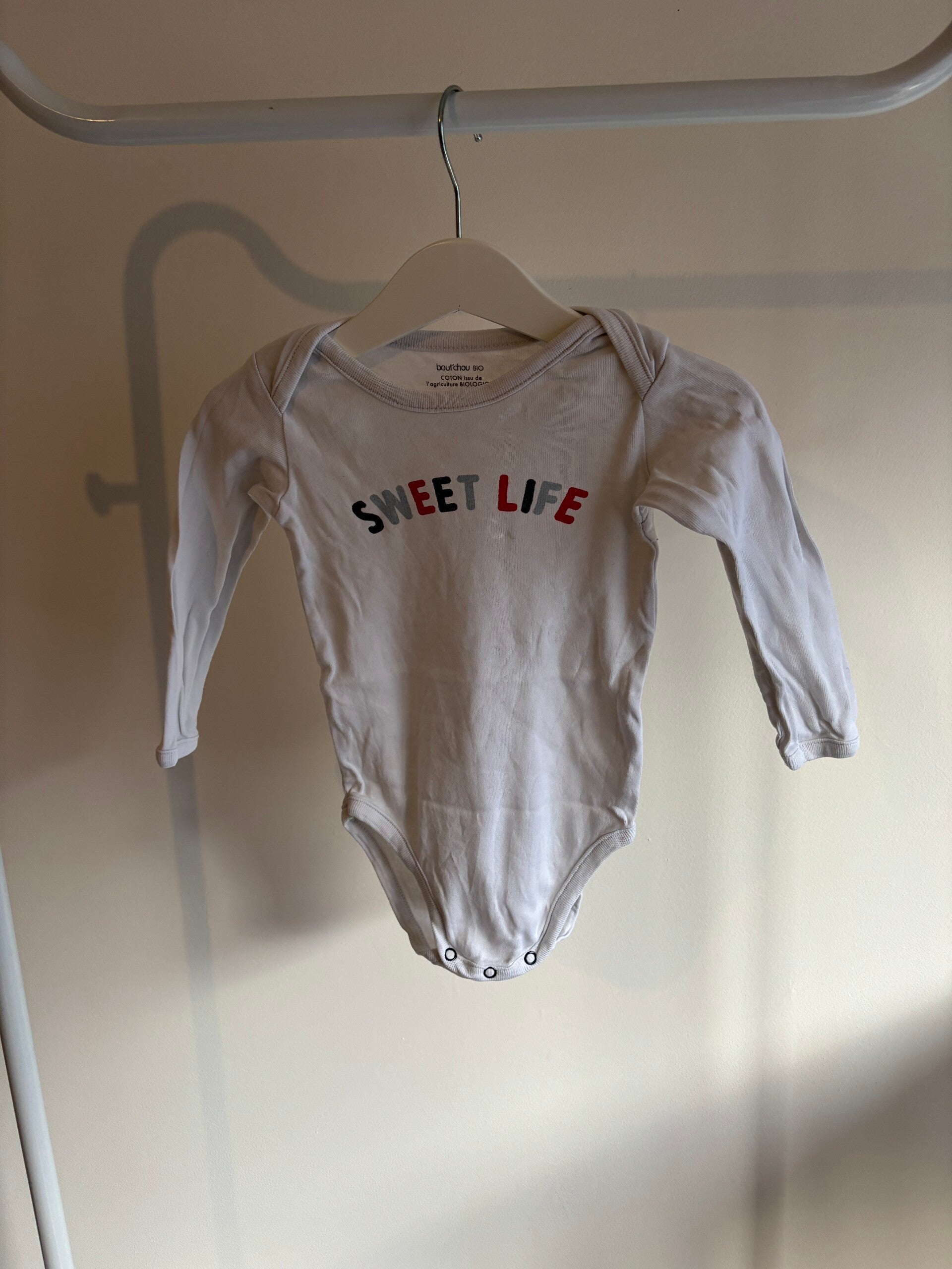 Witte romper met lange mouwen