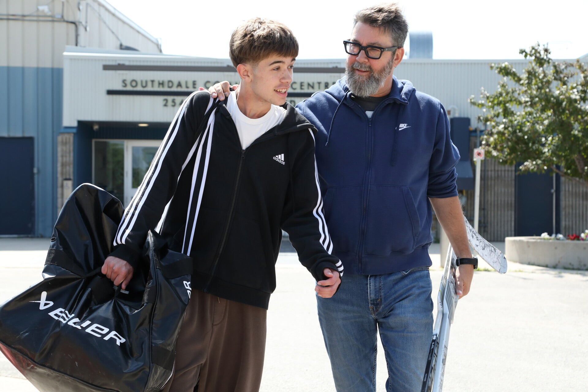 John with his son outside Southdale Community Centre