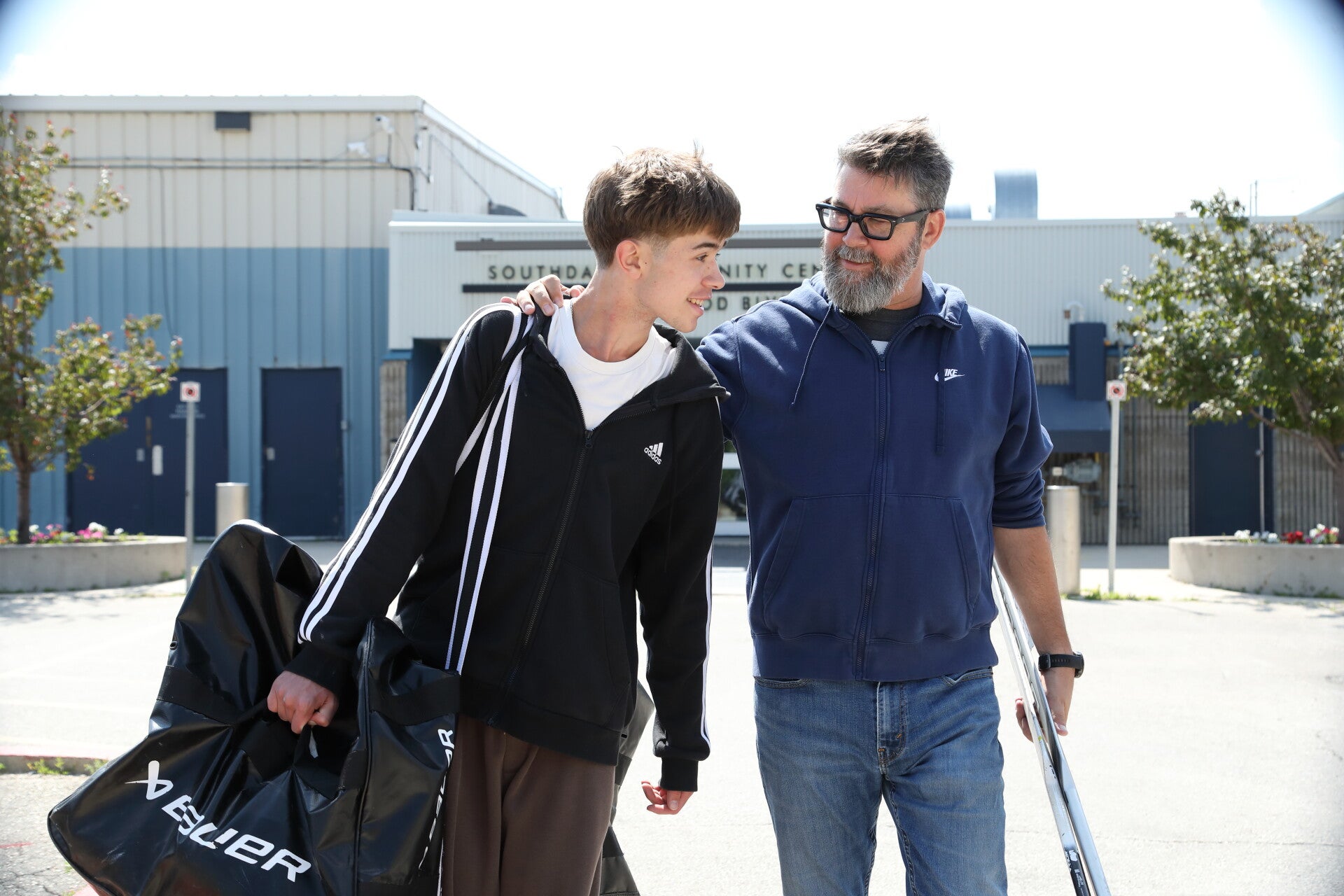 John Baert with son outside Southdale Community Centre