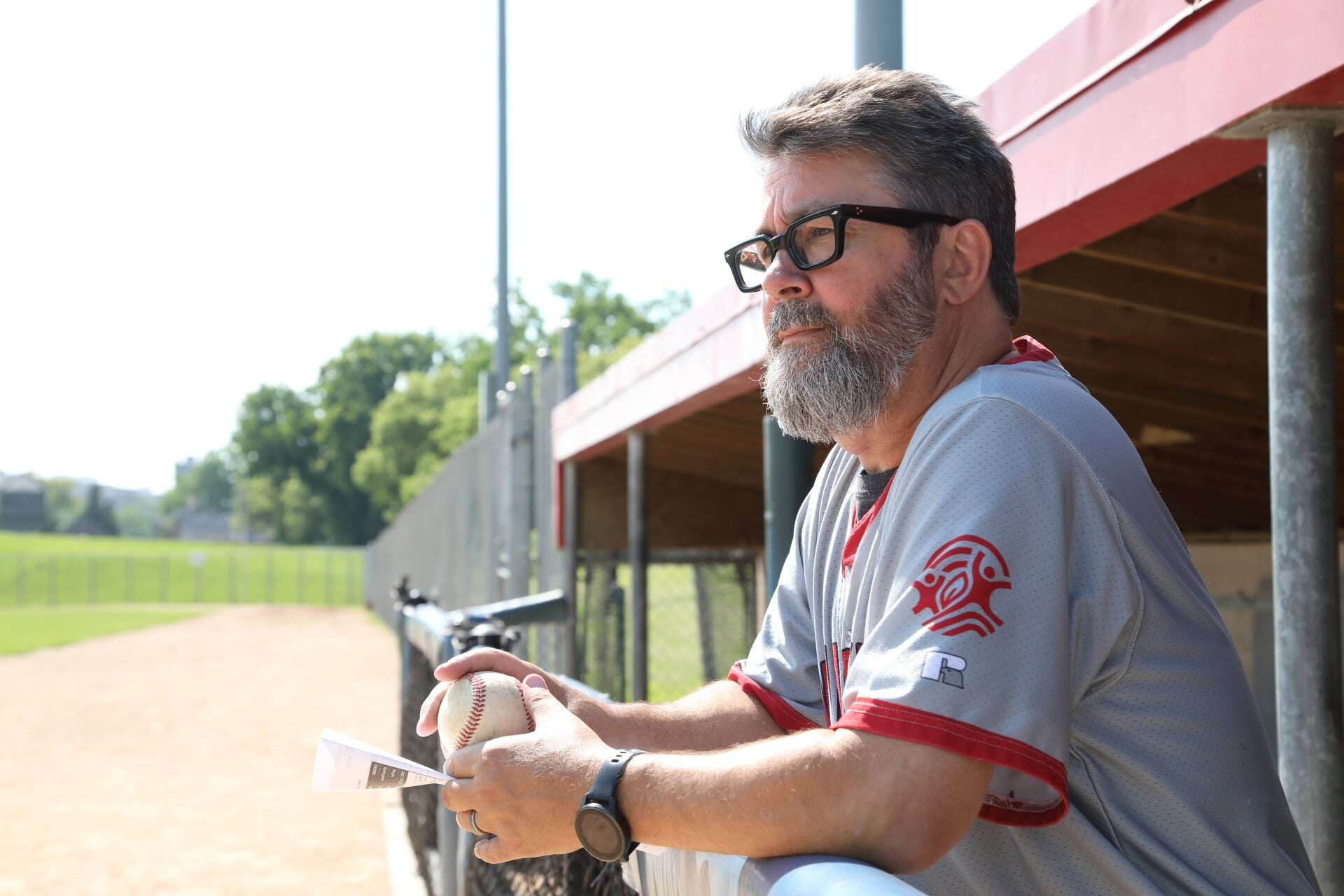 John coaching baseball