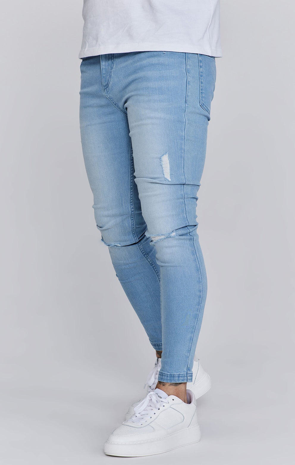 Light blue distressed skinny jeans