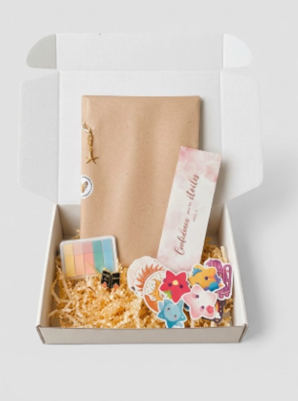 Box avec broché dédicacé.