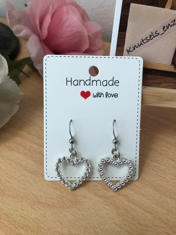 Oorbellen glimmende hartjes ( zilverkleurig)