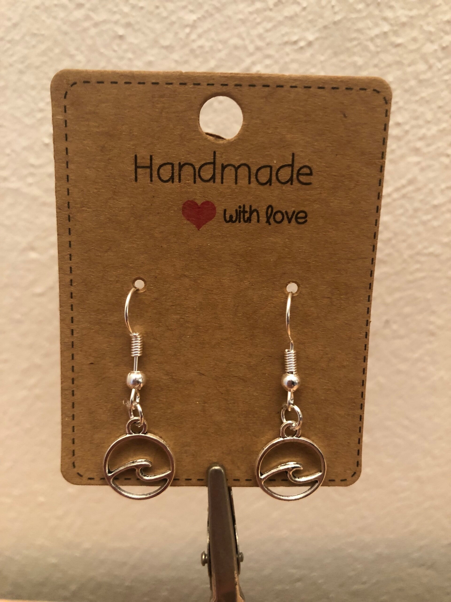 Samen Sterk: Rugvin; oorbellen golf