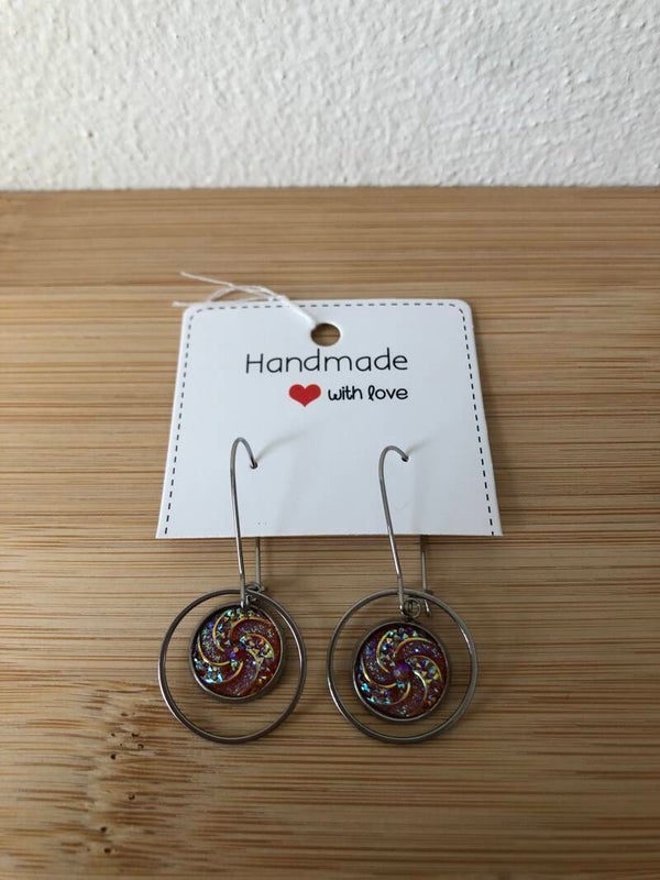 Zilverkleurige hangers met hanger roze glitter