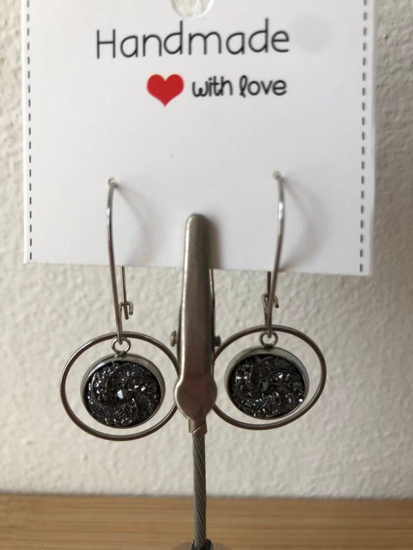 Zilverkleurige hangers met hanger glitter zwart/ grijs