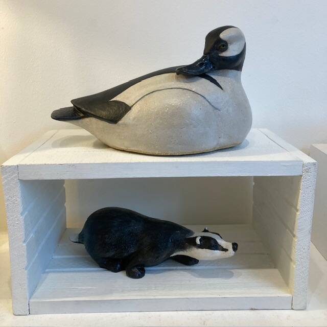 Black and white ceramic duck and badger