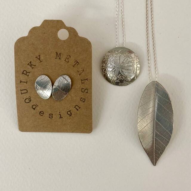 Pewter leaf textured stud earrings and cirular and leaf shaped pendants all in Pewter by Jim Stringer of Quirky metals
