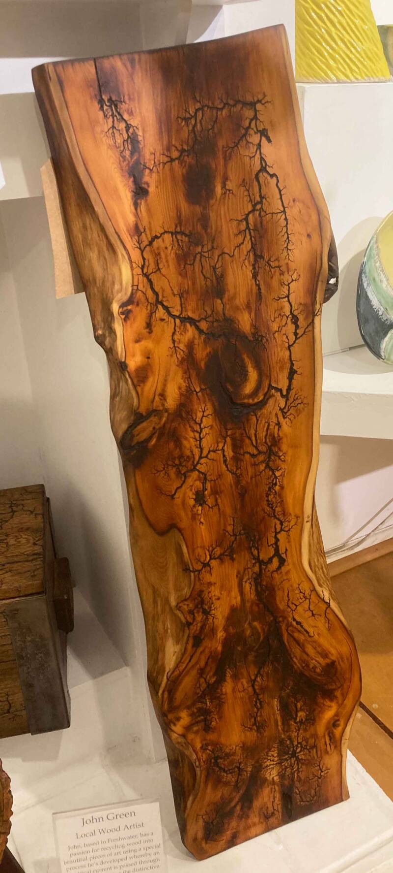 Photo of large cedar wood wall hanging by artist John Green