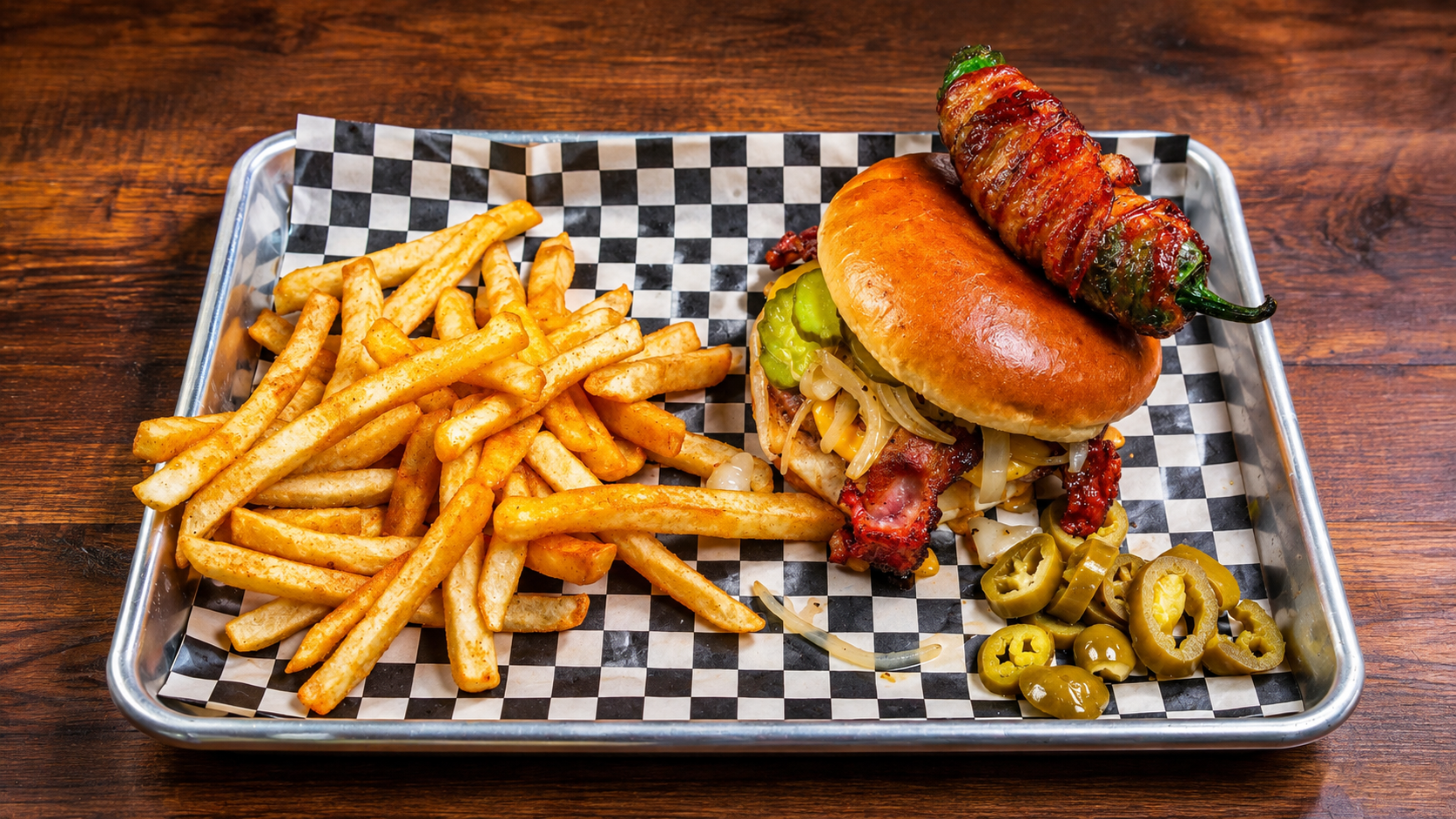     Cowboy Burger topped with a jalapeño popper and fries