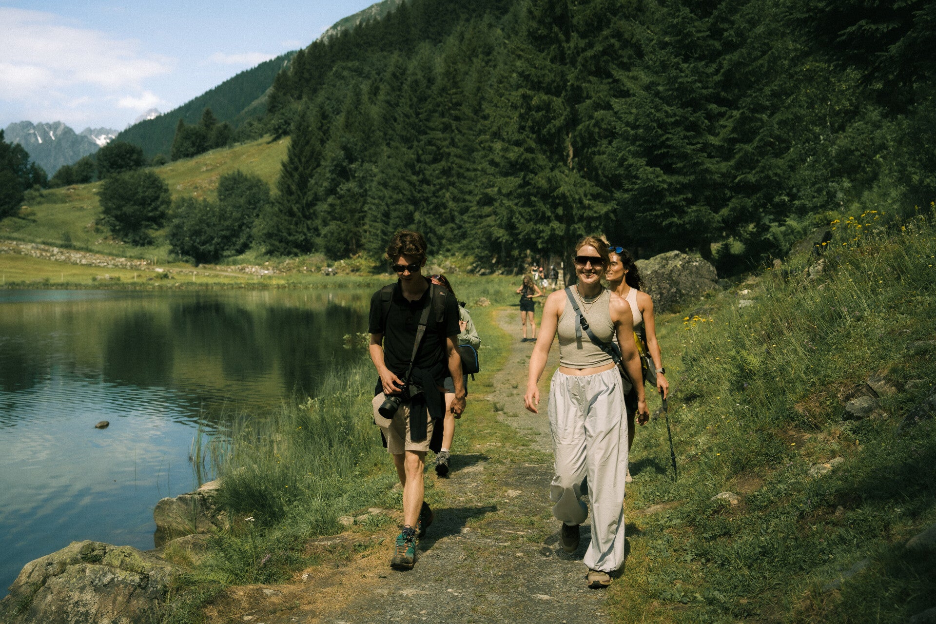 Forest-framed Alpine lake on a summer multi-day route in Switzerland