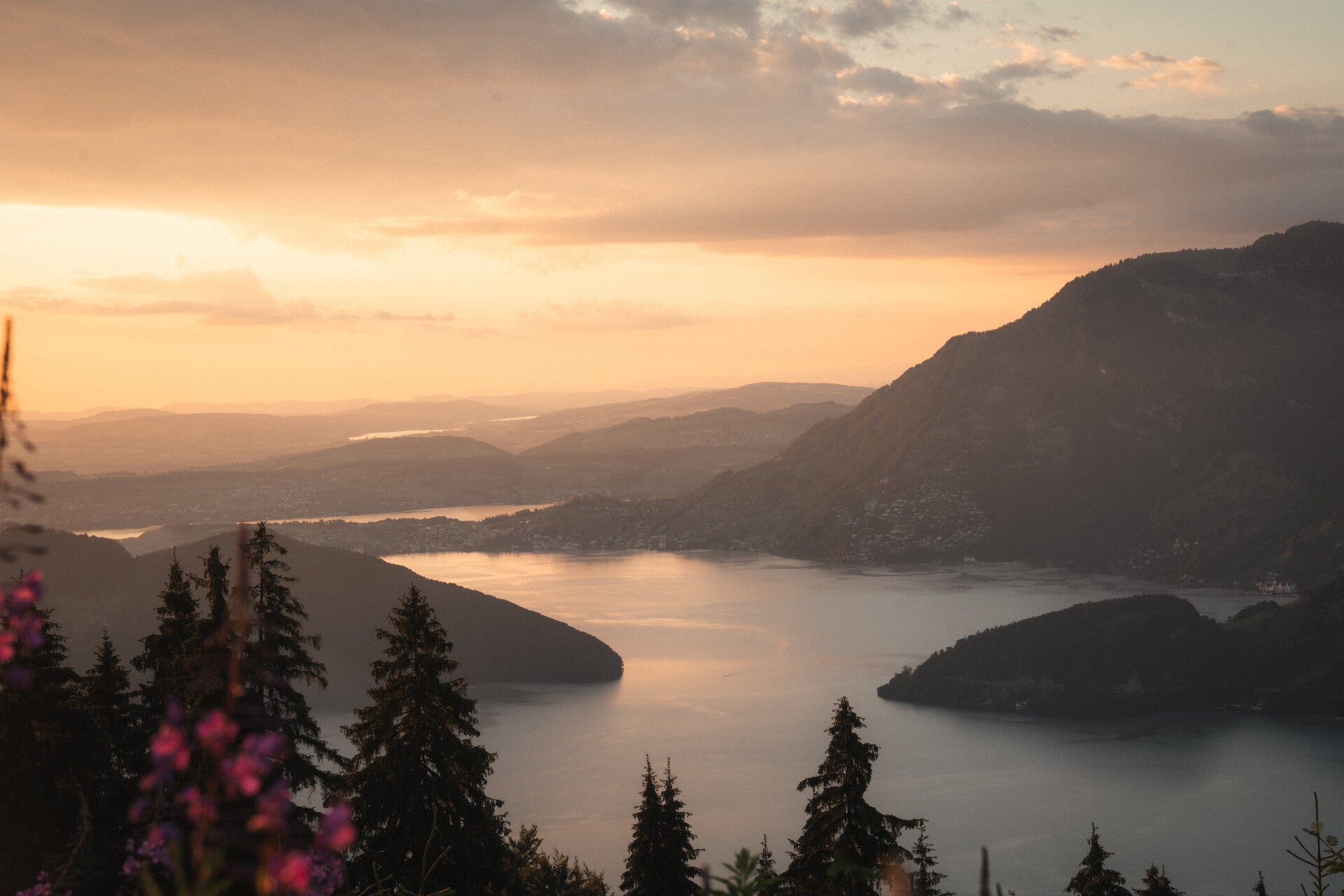 Golden evening light over a Swiss mountain lake during a multi-day journey