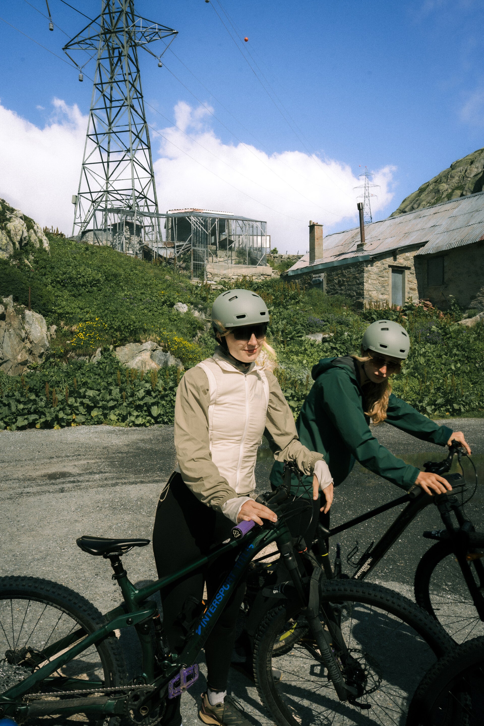 Guided cyclists riding through a Swiss Alpine landscape