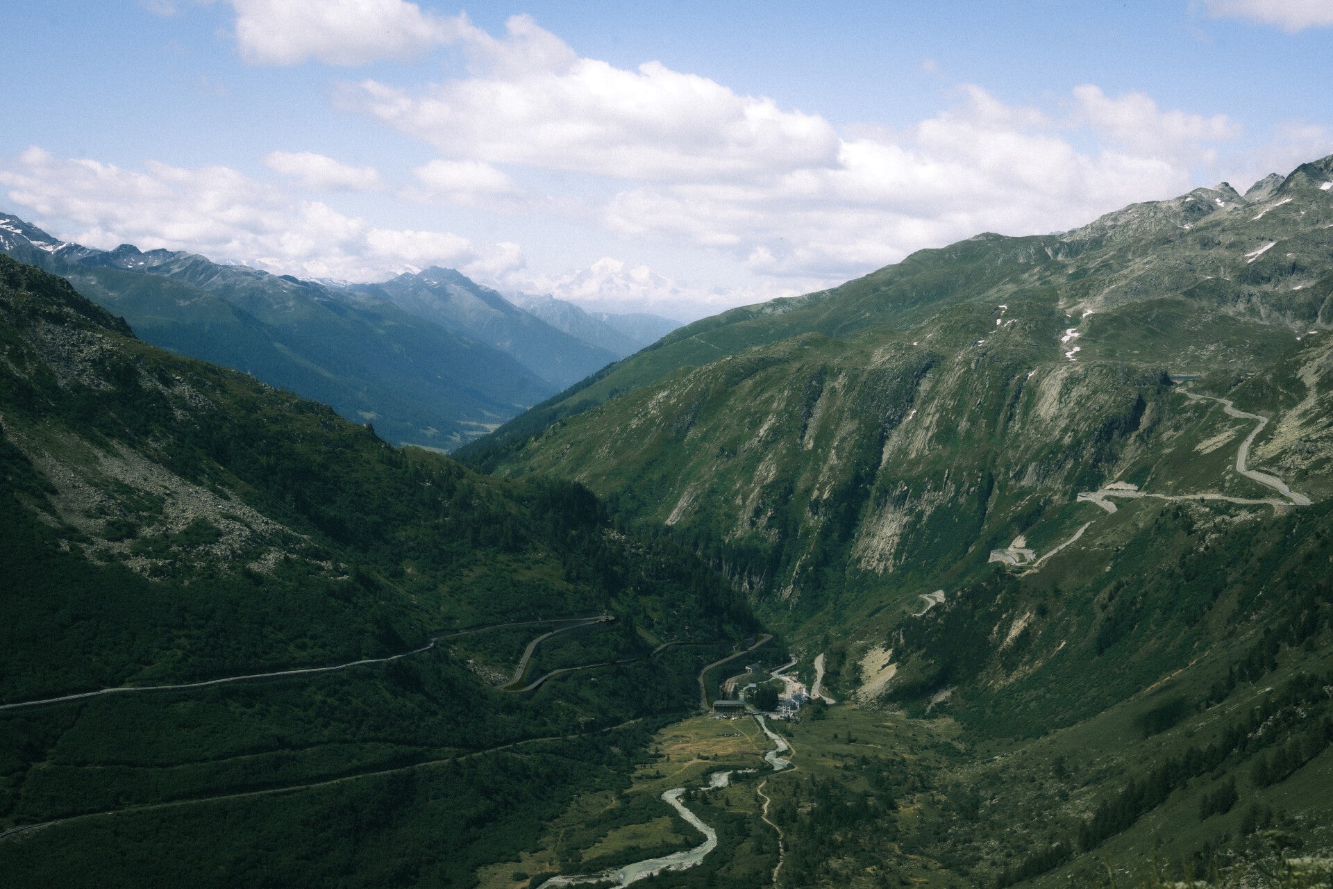Winding scenic road through a high Swiss Alpine valley