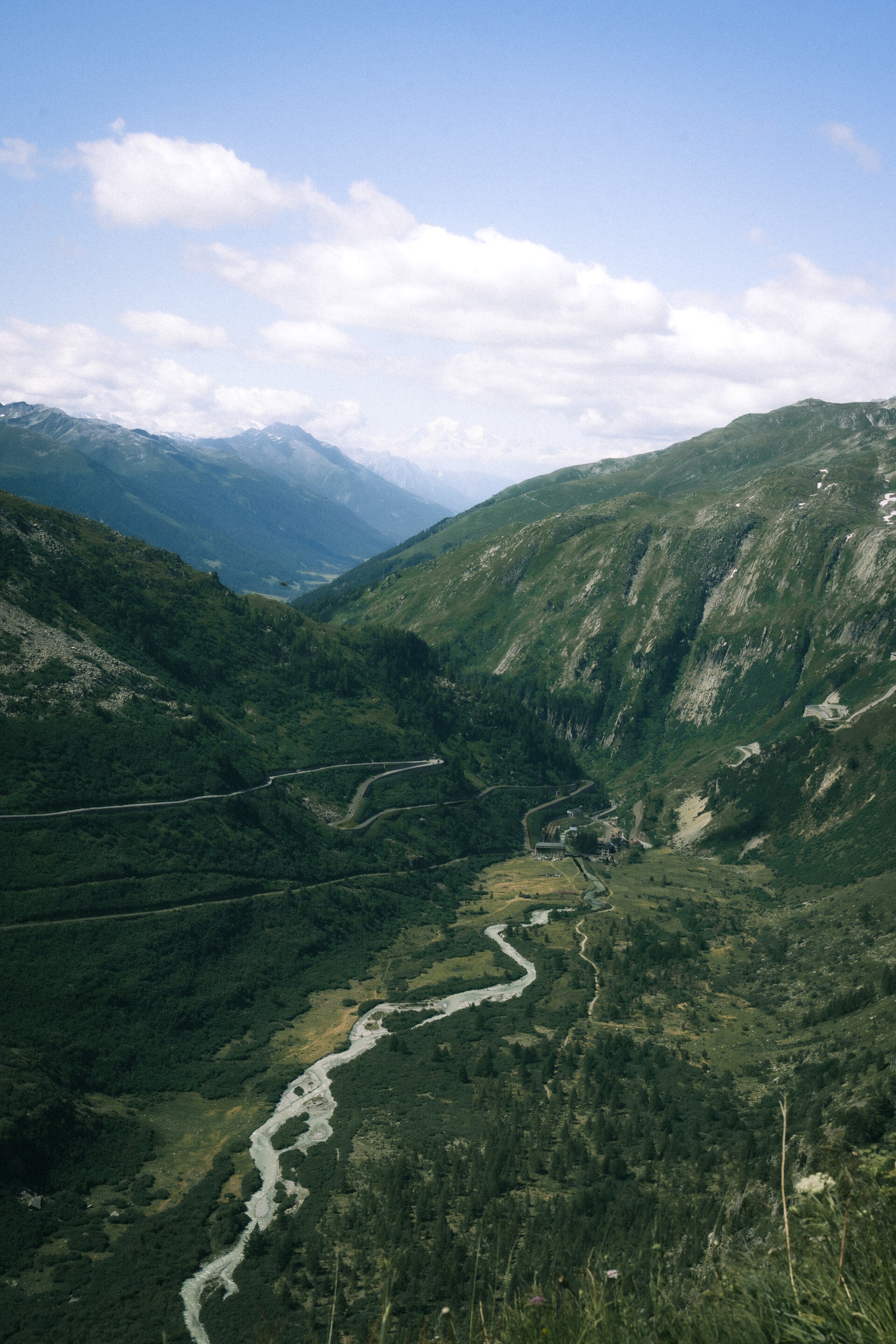Mountain-pass road crossing a rocky Swiss Alpine landscape