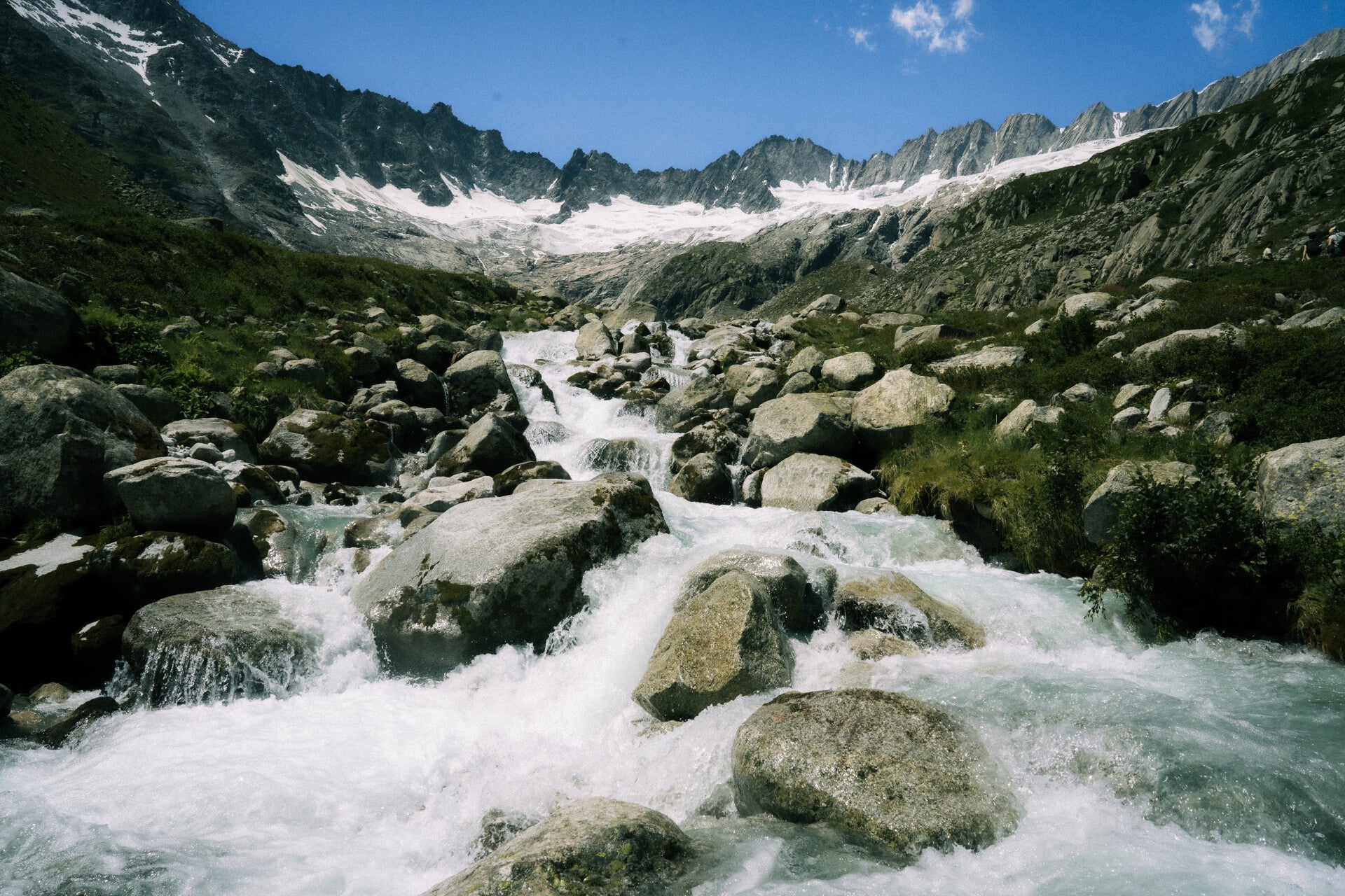 Rocky hiking route through a high Swiss mountain basin