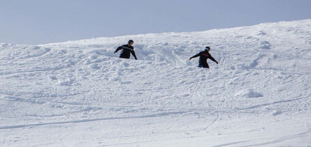 Skiers enjoying a shared winter experience in the Swiss Alps
