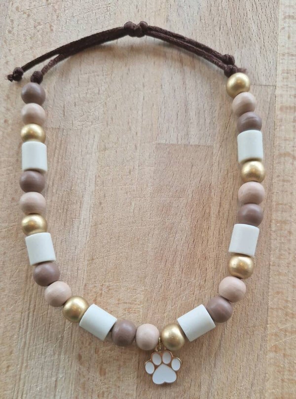 Bruin met pootje maat M