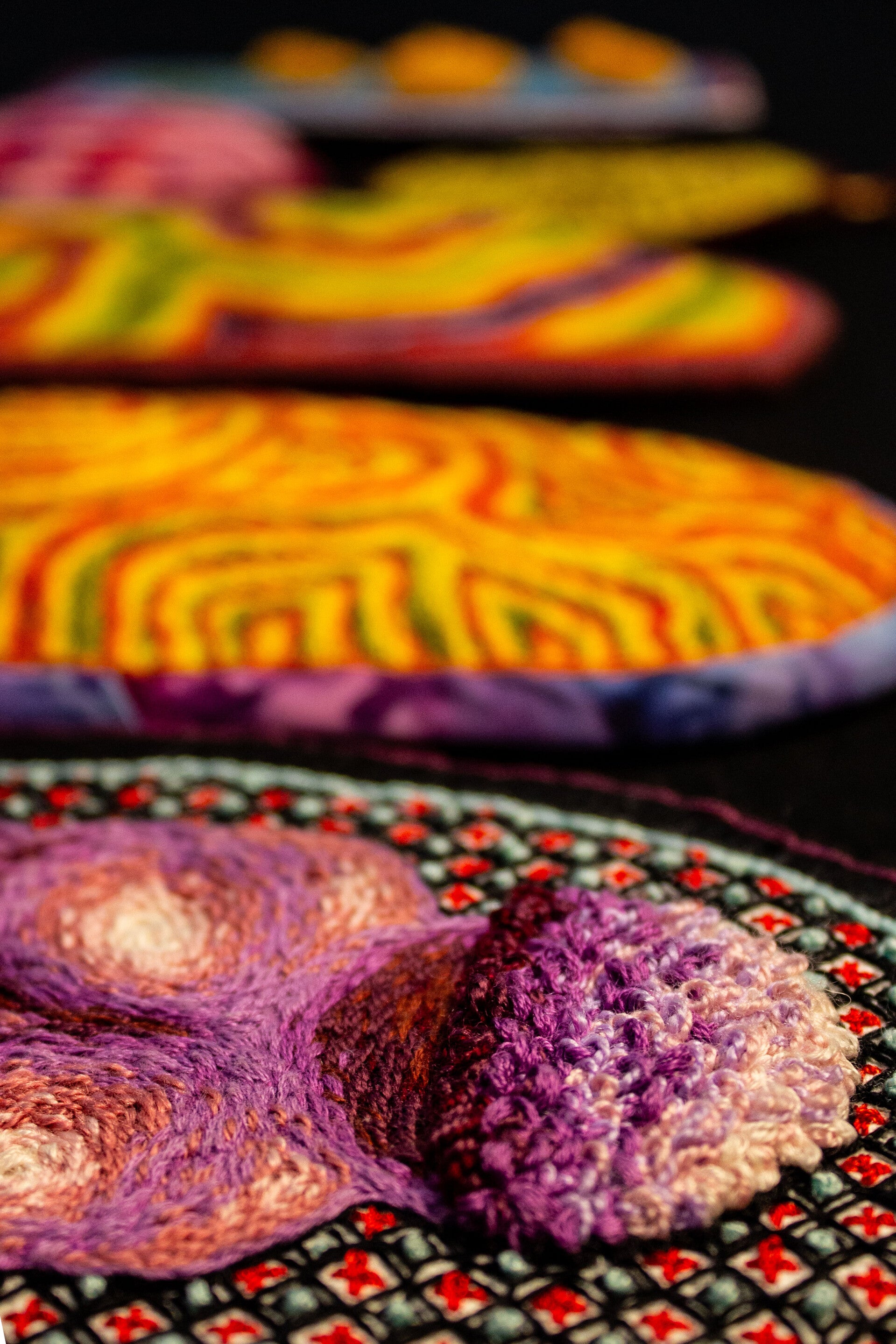 Embroidery artwork of a skull rendered through fine cross-hatching. The piece focuses on the intricate texture and detail created by the stitching, emphasizing form and precision.