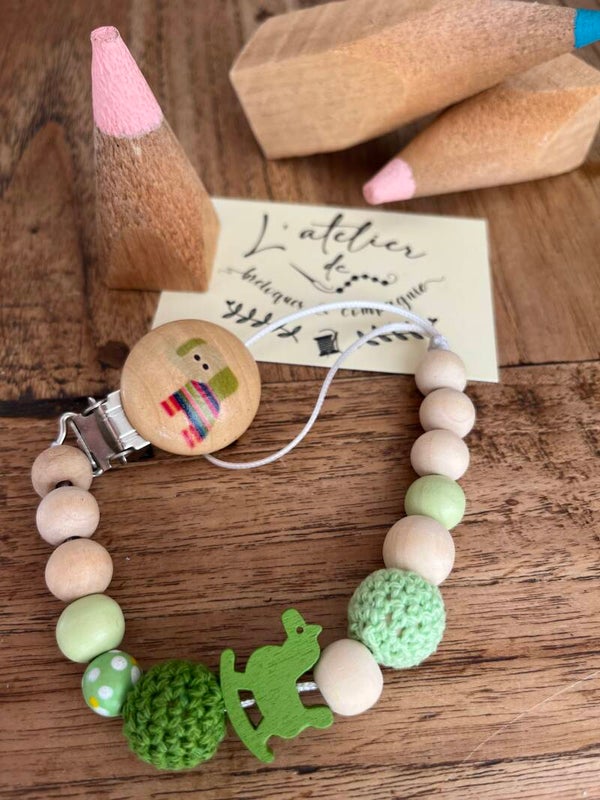 Attache sucette "cheval à bascule"