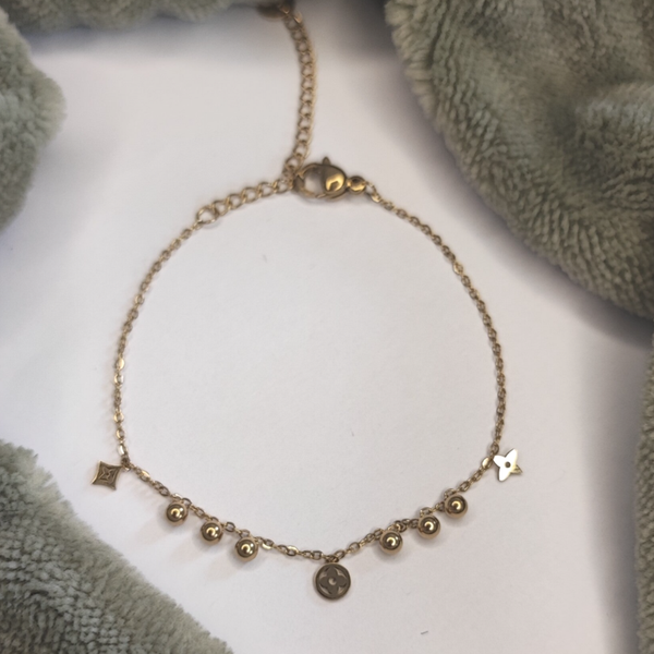 Armband bolletjes en klaver - Stainless Steel - Goud
