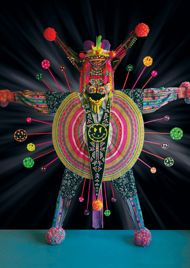 Colorful Textile object made out of reused clothes( smileys & pompoms)