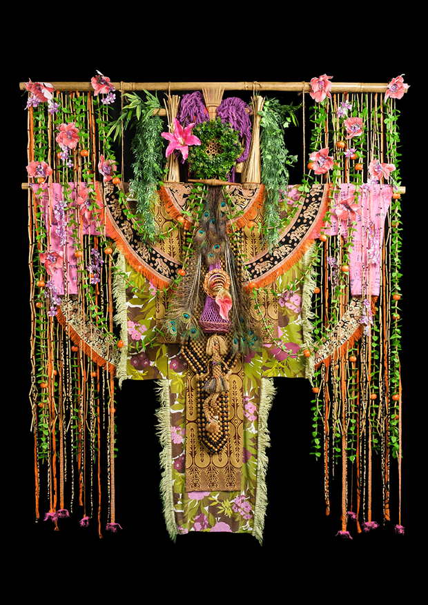 Textile object covered in vines, flowers and leaves