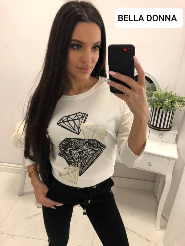 Een katoenen blouse met een decoratieve print.